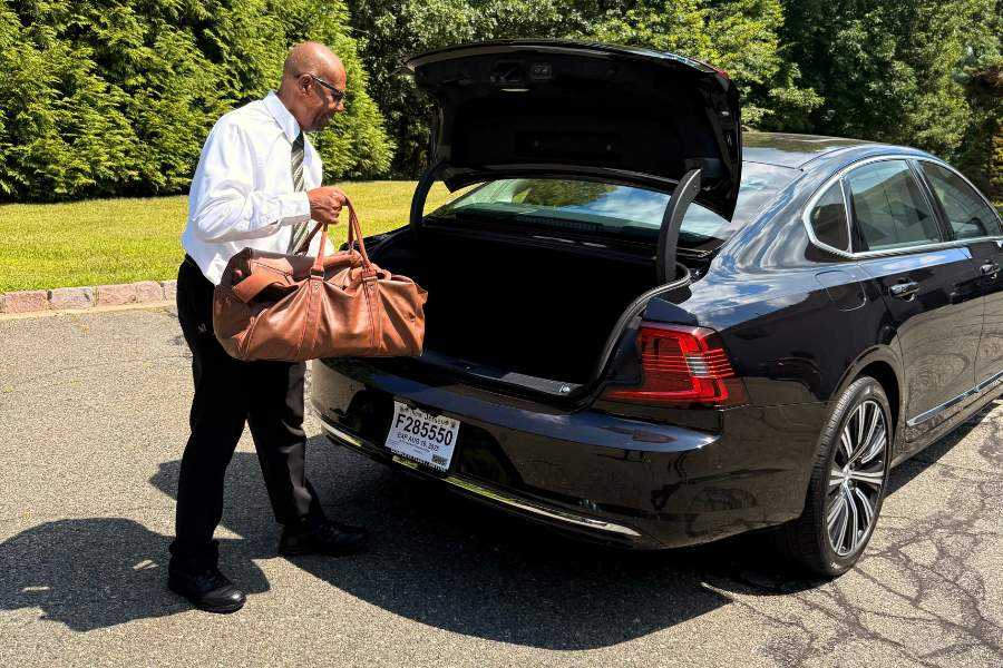 Airport Travel: Shuttle Driver Standing Next To Cab